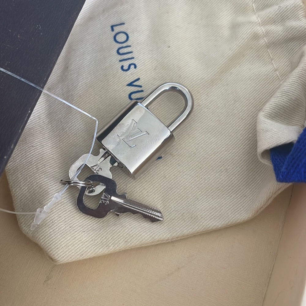 New Authentic Louis Vuitton silver lock and key